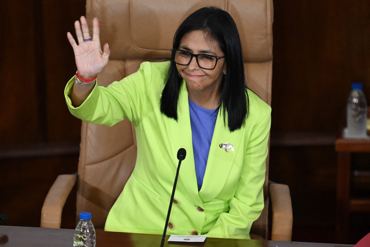 Venezuela's interim President Delcy Rodriguez waves during a presidential address to Parliament at the National Assembly in Caracas on January 15, 2026 (Photo by Federico PARRA / AFP)