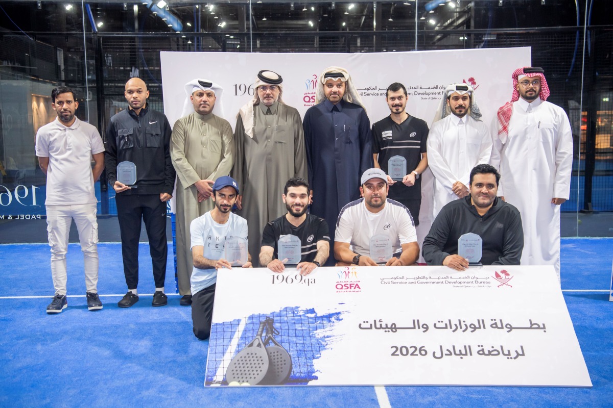 Ashghal team members and officials pose with their trophies at the closing ceremony.