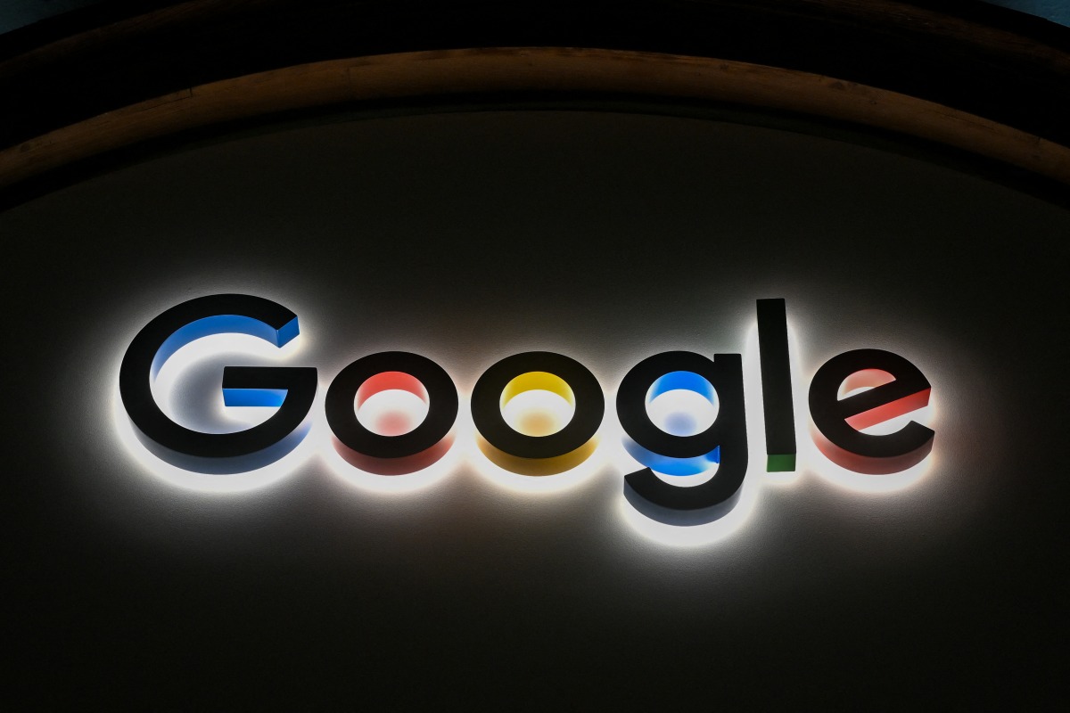 This photograph taken on January 22, 2026, shows a sign of US technology company Google displayed during the World Economic Forum (WEF) annual meeting in Davos. (Photo by Fabrice COFFRINI / AFP)
