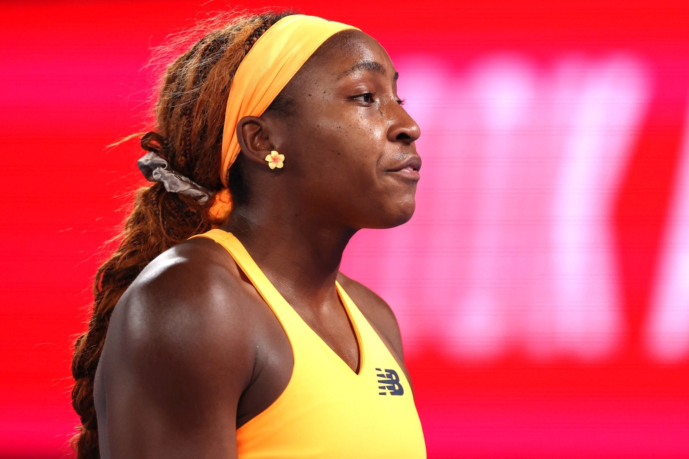USA's Coco Gauff reacts on point to Ukraine's Elina Svitolina during their women's singles quarter-final match on day ten of the Australian Open tennis tournament in Melbourne on January 27, 2026. (Photo by Martin Keep / AFP)