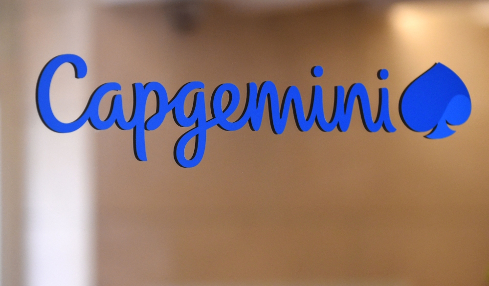 This photograph shows a logo of French IT company Capgemini at the Capgemini headquarters in Paris on June 25, 2019. (Photo by Eric Piermont / AFP)