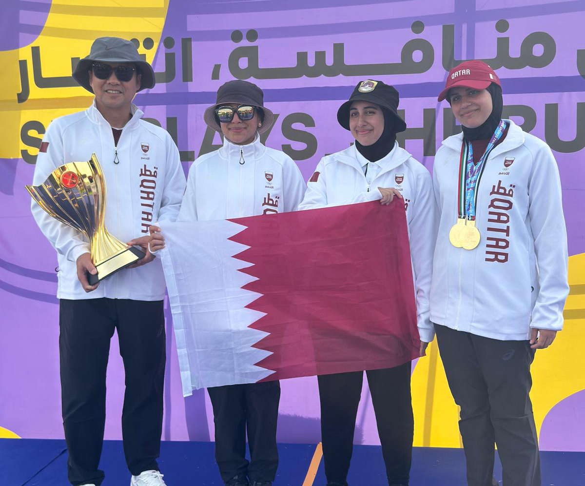 Team Qatar archers celebrate.