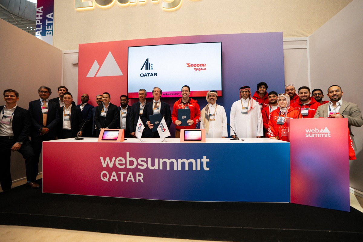 Founder and Chief Executive Officer of Snoonu Hamad Mubarak Al Hajri with representatives of Alvarez & Marsal and other attendees during a signing ceremony on the sidelines of Web Summit.