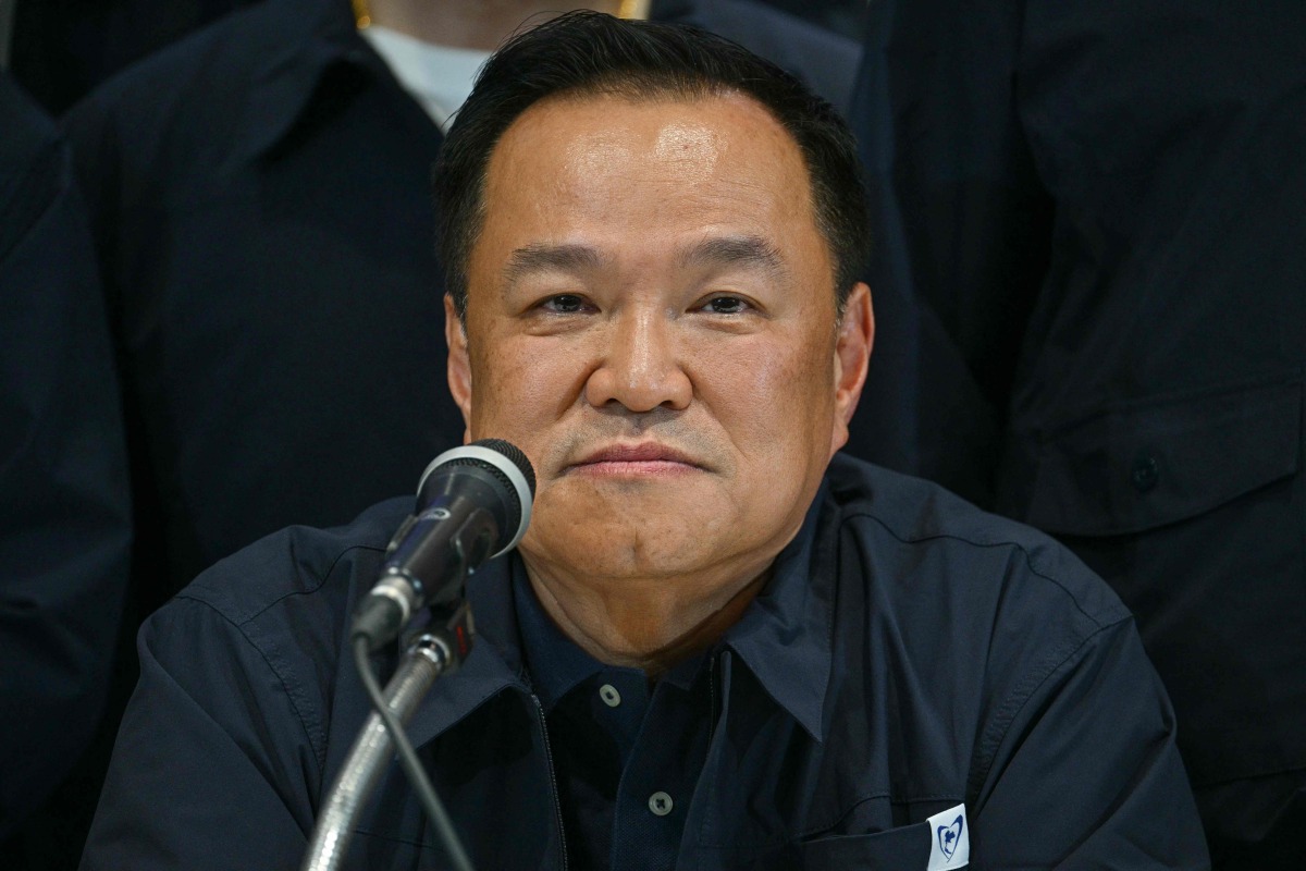 Thailand's Prime Minister and BhumjaiThai Party leader Anutin Charnvirakul attends a press conference while awaiting final results in Thailand's general election in Bangkok on February 8, 2026. Anutin claimed victory in the country's general election on Sunday after television projections showed his party with the most seats in parliament by far. (Photo by ANTHONY WALLACE / AFP)
