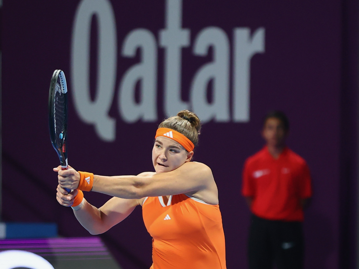 Karolina Muchova hits a return to Jaqueline Cristian.