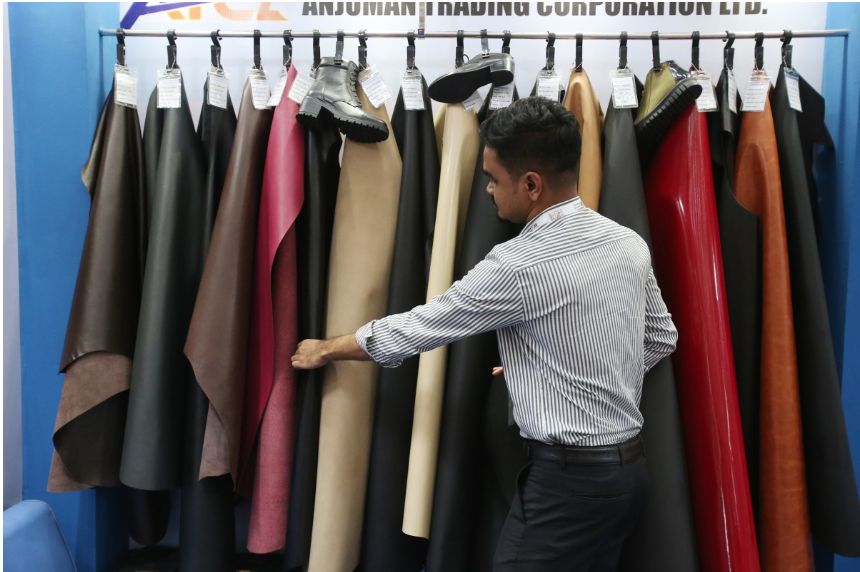 An exhibitor arranges leather products at the 9th edition of Bangladesh Leather and Footwear Expo in Dhaka, Bangladesh, on July 24, 2025. (Photo by Habibur Rahman/Xinhua)
