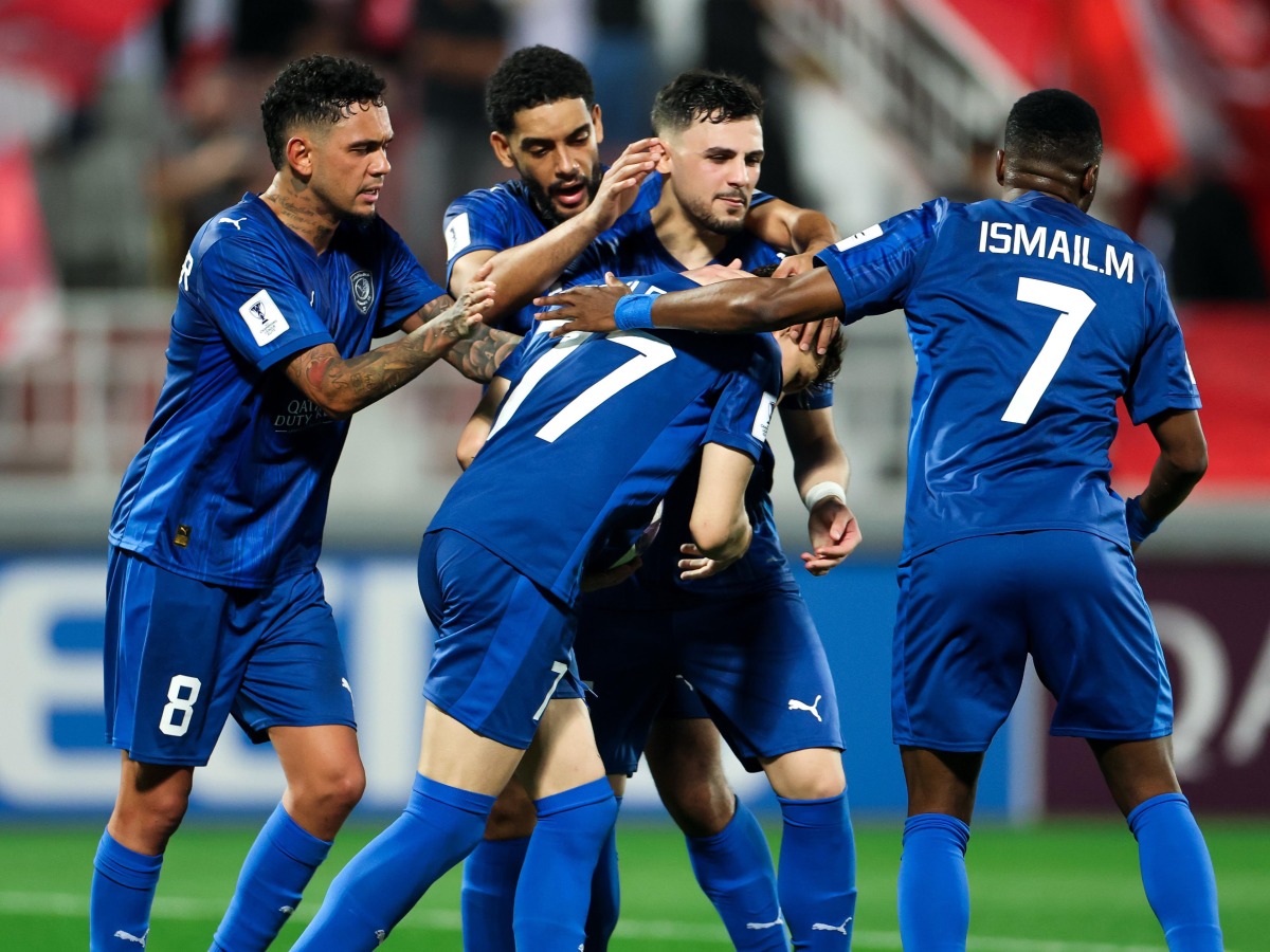 Al Duhail players celebrate the equaliser.