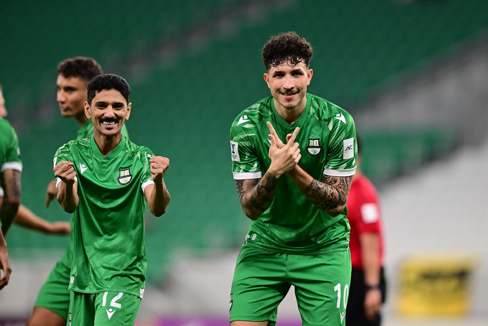 Al Ahli’s Erik Exposito (right) celebrates after scoring a goal. 