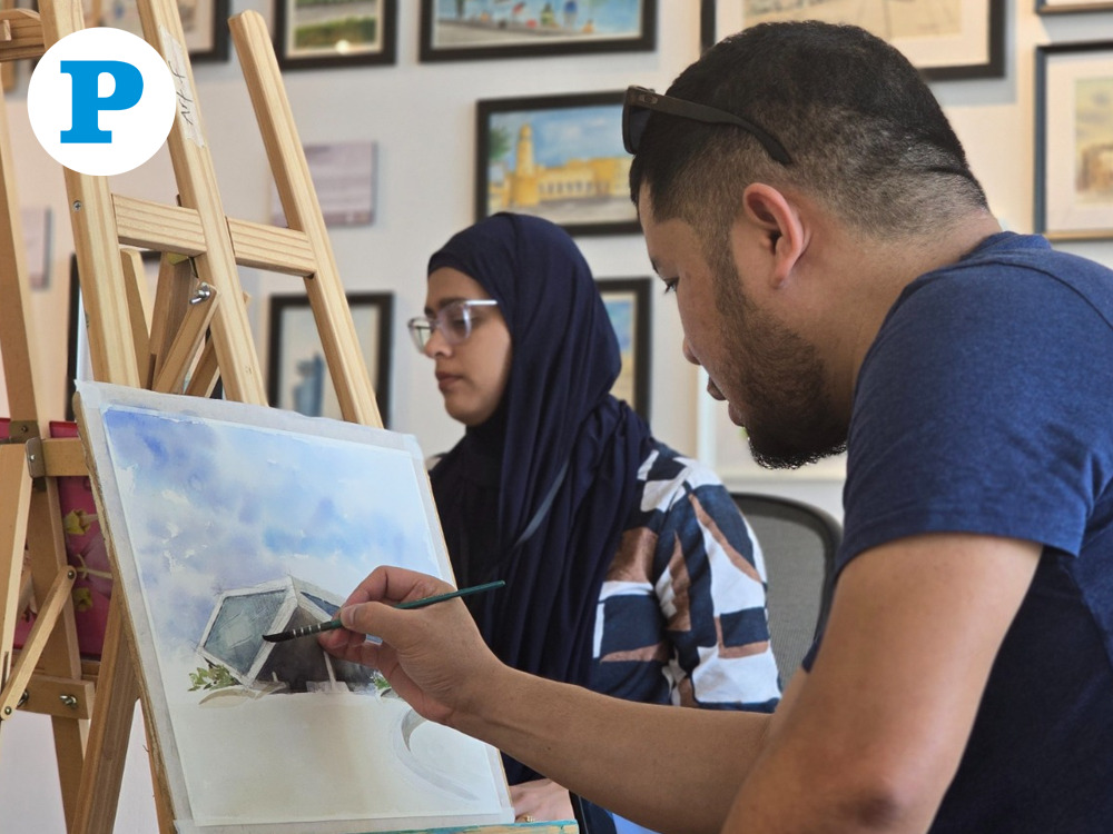 Adrian Aleluya live-painting during the exhibition. Pic by Hana Ramadan/The Peninsula