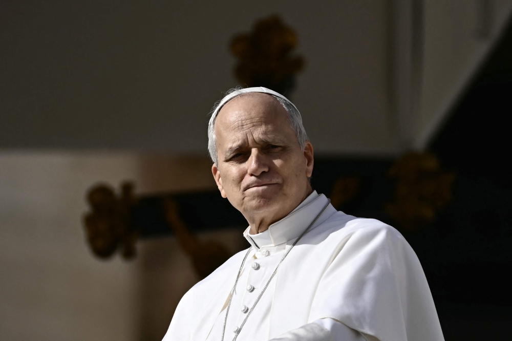 Pope Leo XIV looks on during the weekly general audience at St Peter's Square in The Vatican on February 18, 2026. (Photo by Filippo Monteforte / AFP)