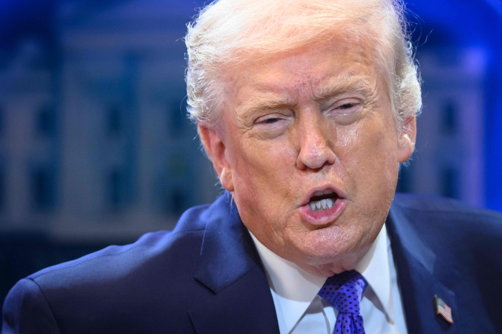 US President Donald Trump speaks during a press conference in the Brady Press Briefing Room of the White House in Washington, DC, on February 20, 2026. (Photo by Mandel Ngan / AFP)
