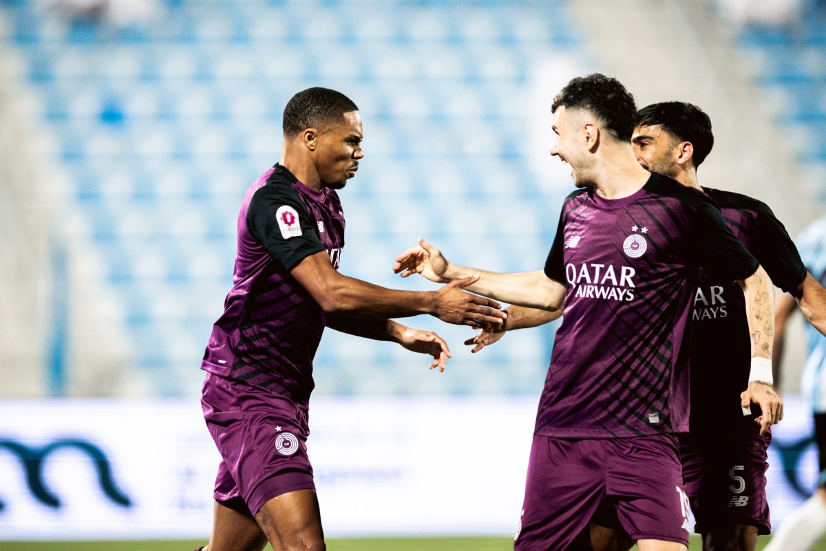 Pedro Miguel (left) celebrates with teammate Rafa Mujica after scoring Al Sadd's opening goal.