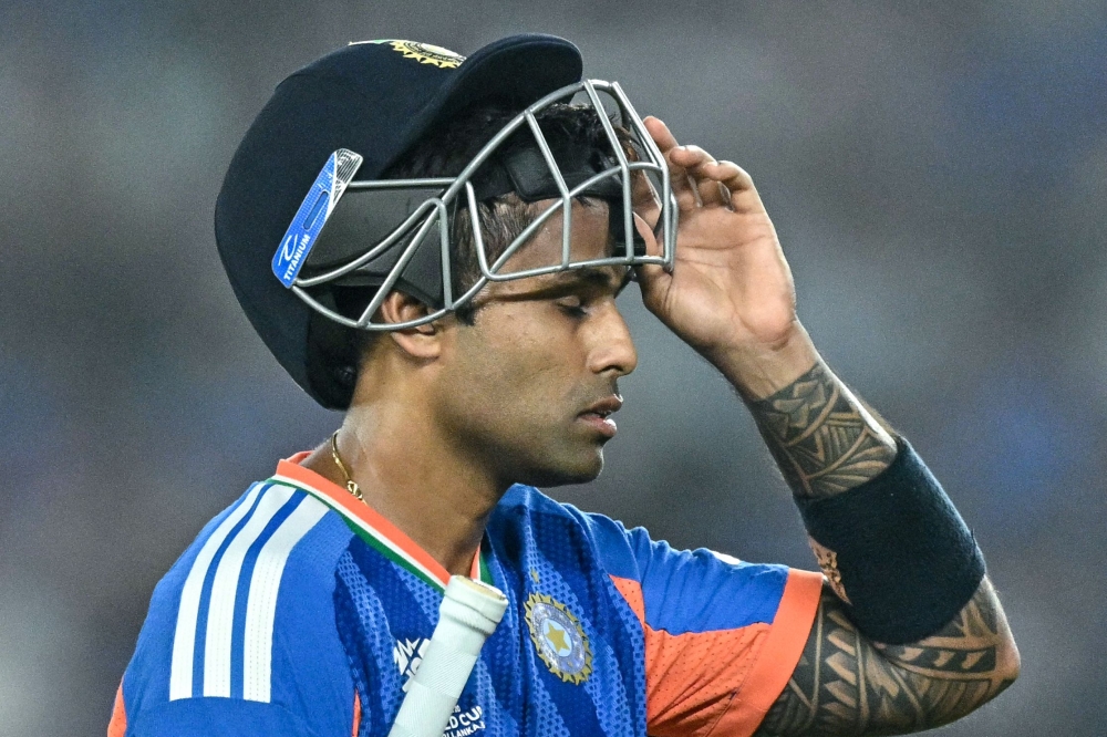 India's captain Suryakumar Yadav walks back to the pavilion after his dismissal in Ahmedabad on February 22, 2026. (Photo by Manan Vatsyayana / AFP)