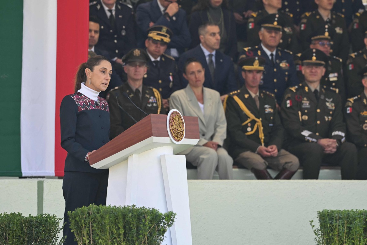 Mexico's President Claudia Sheinbaum delivers a speech during the celebration of Flag Day in Mexico City on February 24, 2026. (Photo by YURI CORTEZ / AFP)