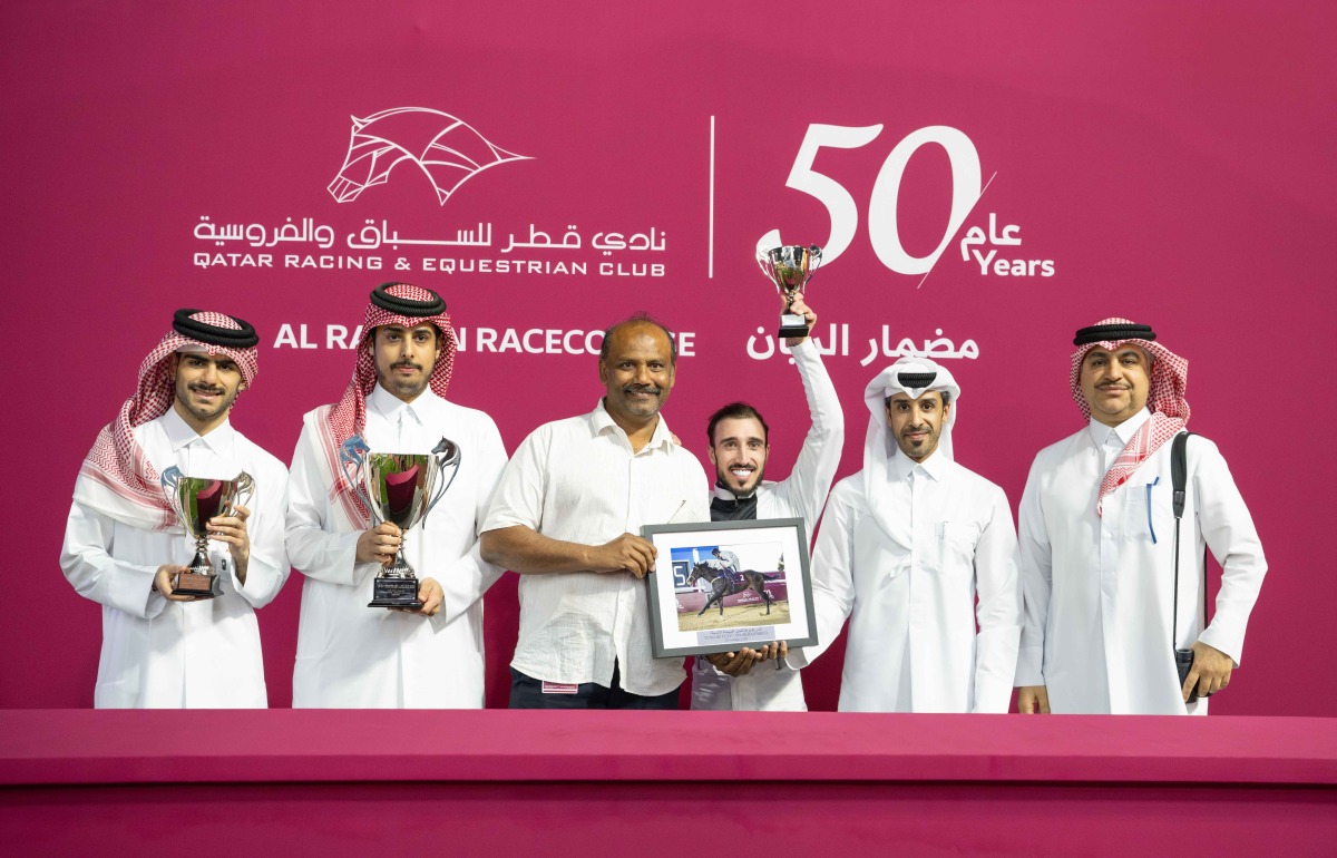 Deputy Director of QREC Registration & Studbook Department Saad Ali Al Kubaisi presented the Fuwairit Cup to connections of Townsend Manor. PICS: Juhaim/QREC