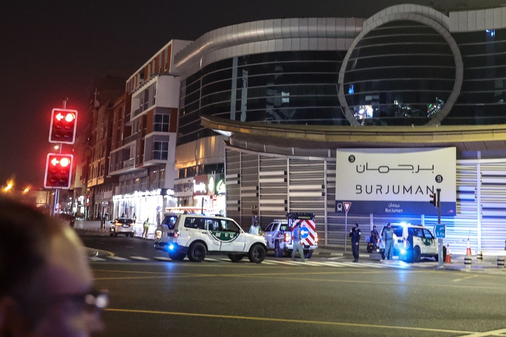Emirati police vehicles deploy near the US Consulate, in Dubai on March 3, 2026. (Photo by Fadel Senna / AFP)