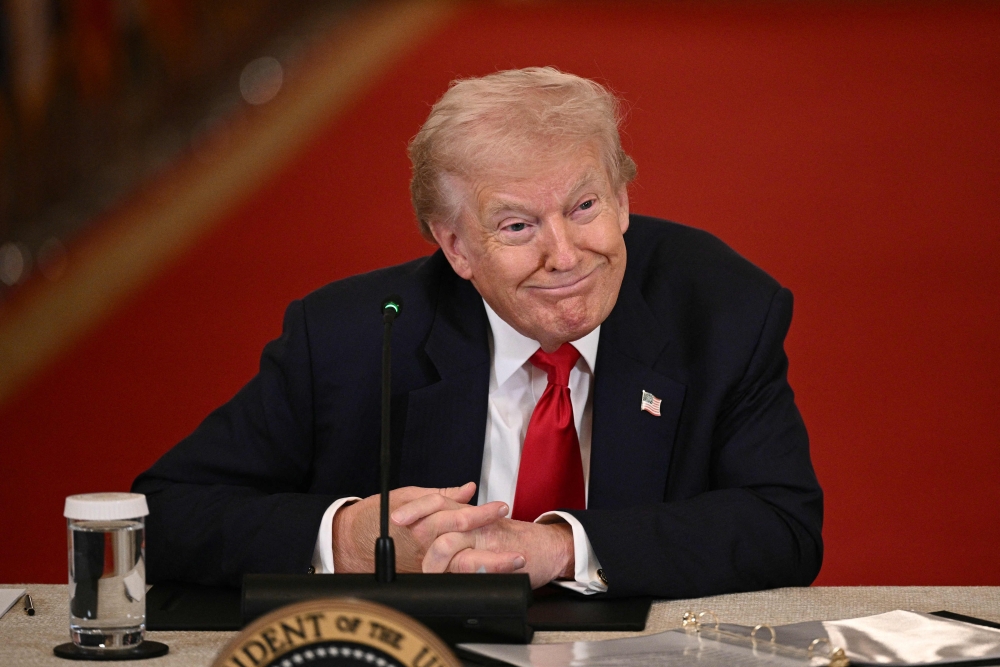 US President Donald Trump listens during a roundtable in the East Room of the White House in Washington, DC, on March 6, 2026. (Photo by Brendan Smialowski / AFP)