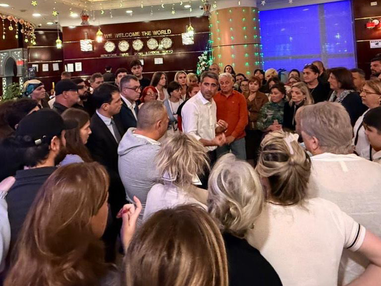 Ambassador of Georgia H E Varlam Avaliani with Georgian citizens who were repatriated. 