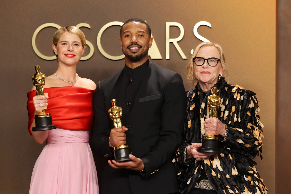 (L-R) Jessie Buckley, Michael B. Jordan, and Amy Madigan pose in the press room. Mike Coppola/Getty Images/AFP 