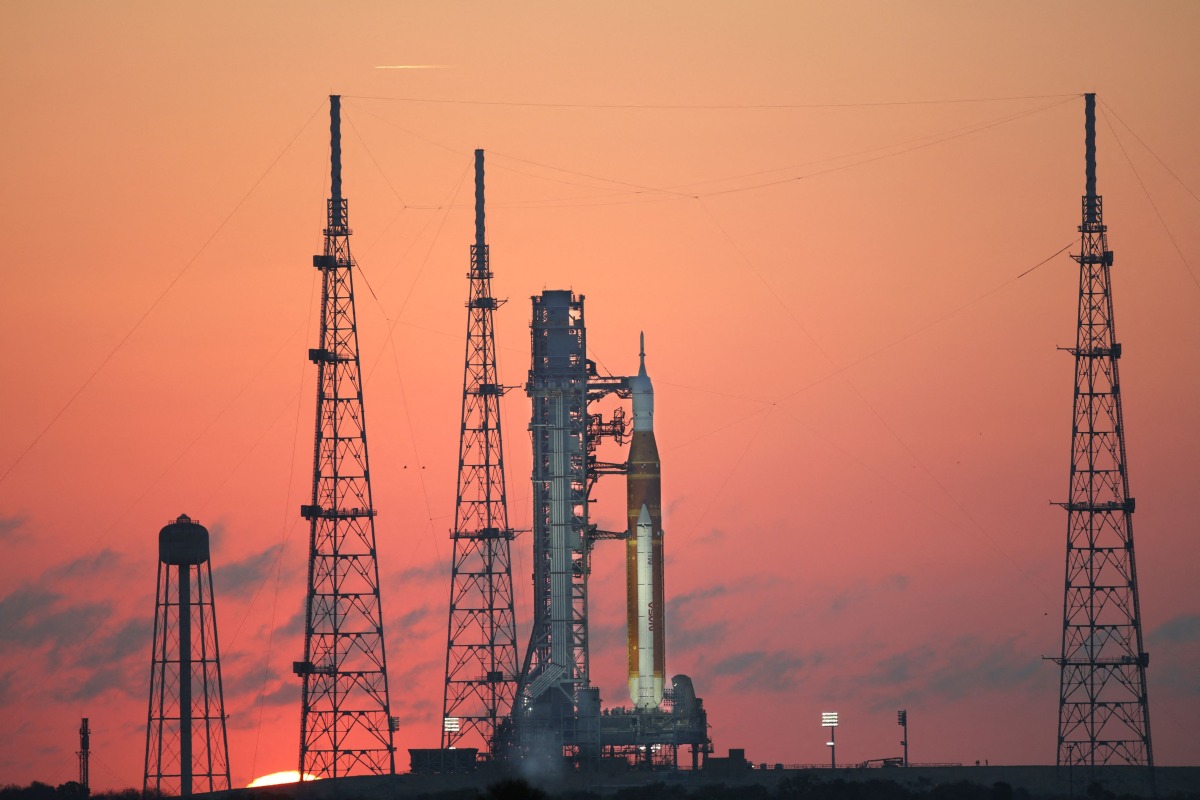 NASA's Artemis II Space Launch System (SLS) rocket and Orion spacecraft are seen at sunrise at Launch Pad 39B at the Kennedy Space Center in Cape Canaveral, Florida on March 24, 2026. Photo by Gregg Newton / AFP