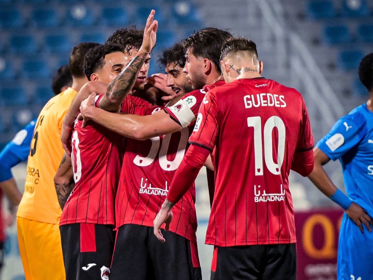 Al Rayyan players celebrate a goal against Al Shahania. 
