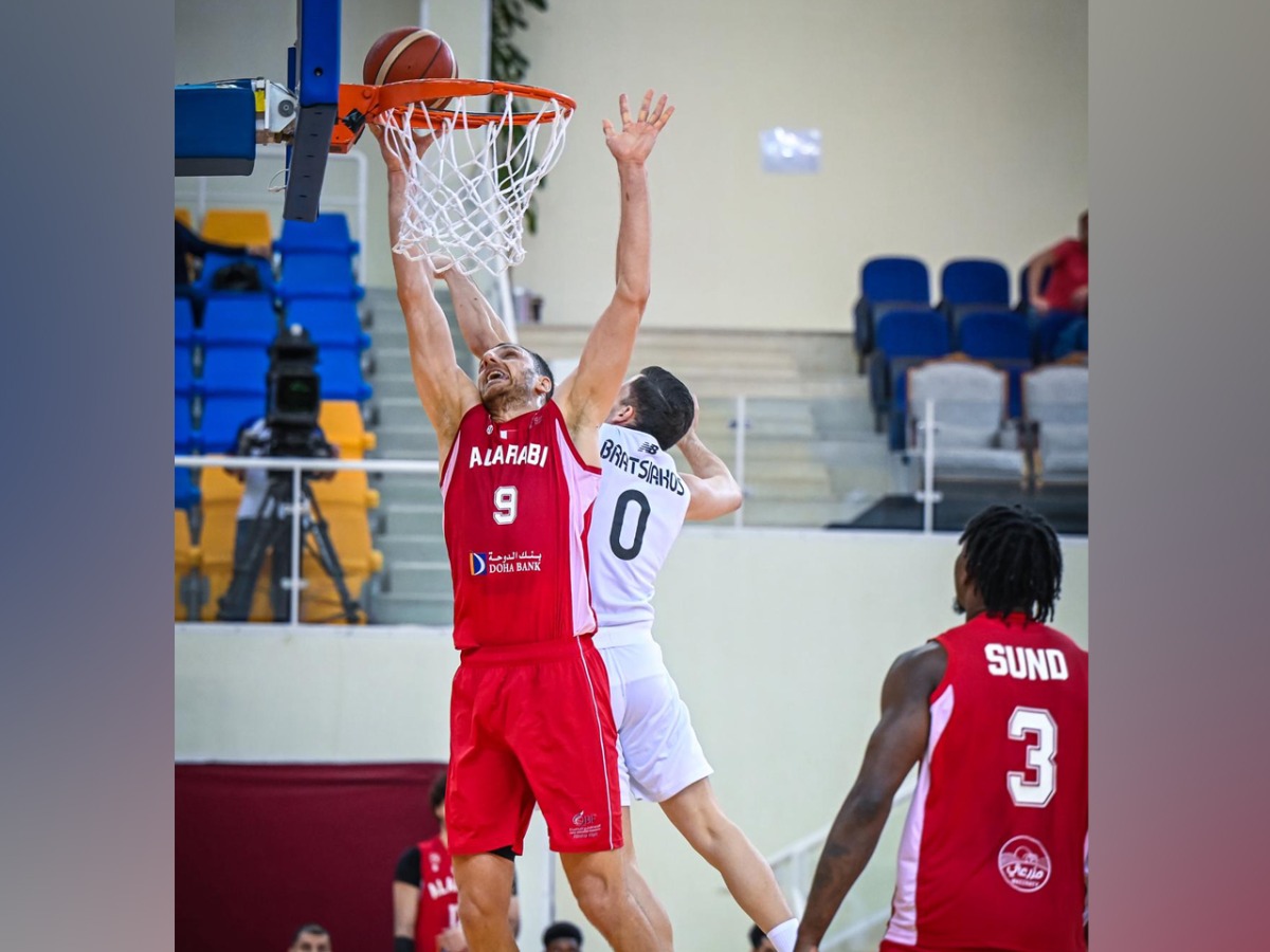 Al Arabi's Elmedin Kikanovic (left) shoots to score.