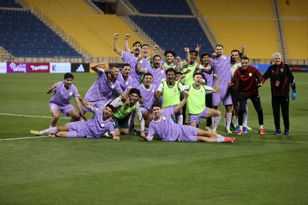 Muaither players celebrate their victory.