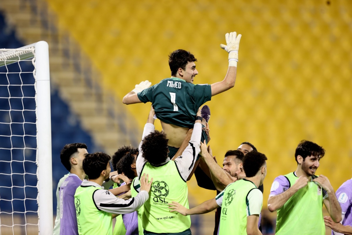 Muaither's goalkeeper Majed Abdullatif is tossed in the air as players celebrate their win over Al Arabi in the semi-final.