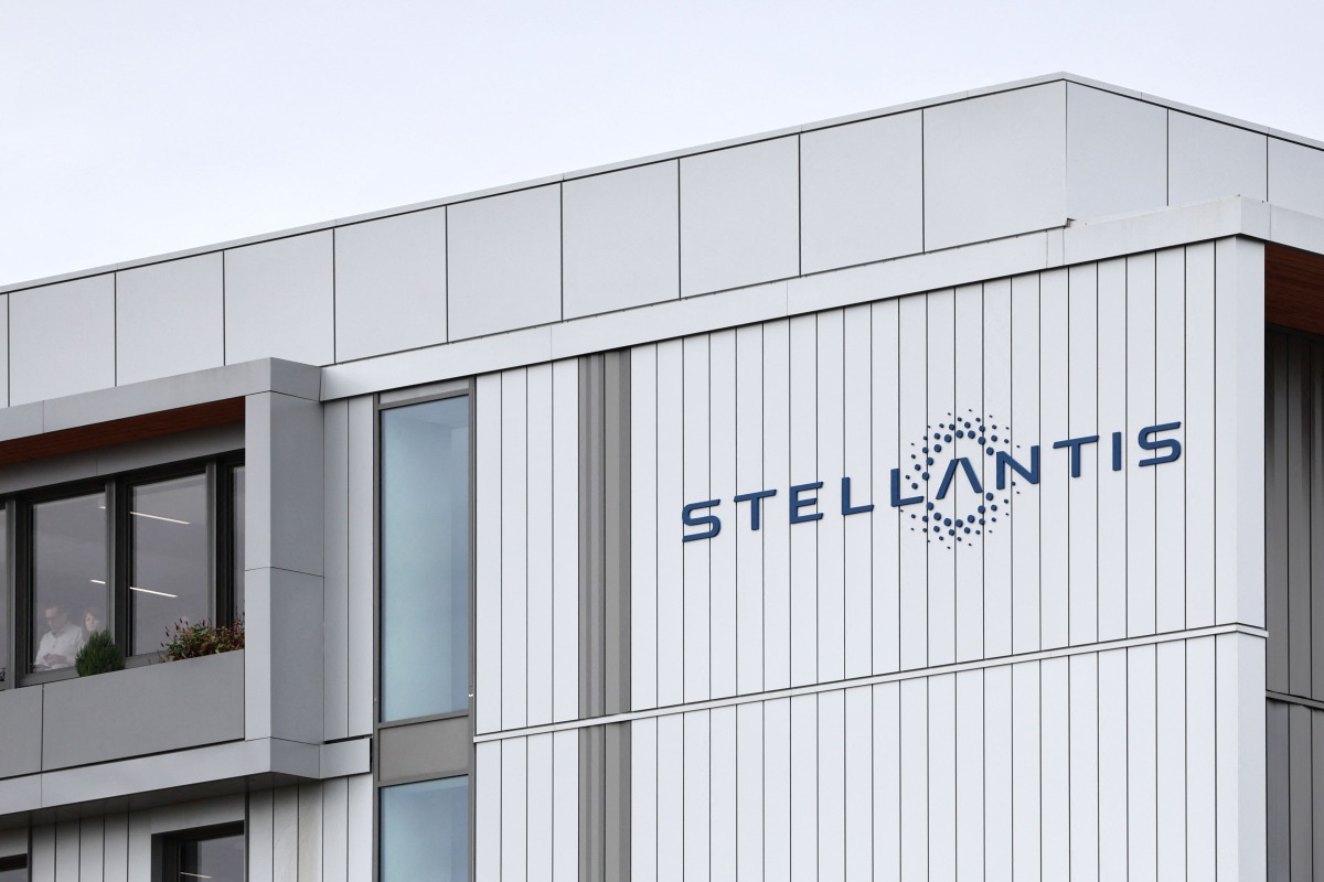 This photograph shows Stellantis' logo displayed on the premises of the multinational car manufacturer's plant in Poissy, west of Paris, on September 23, 2025. Photo by Thibaud MORITZ / AFP