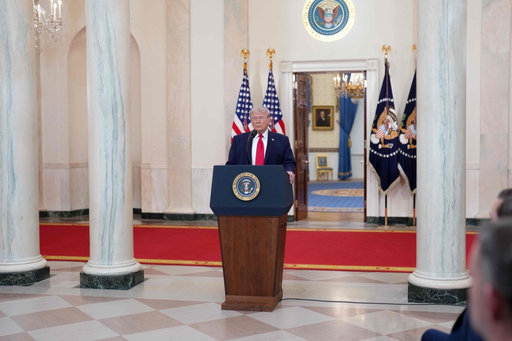 US President Donald Trump speaks during a televised address on the conflict in the Middle East from the Cross Hall of the White House in Washington, DC on April 1, 2026. (Photo by Doug Mills / Pool / AFP)