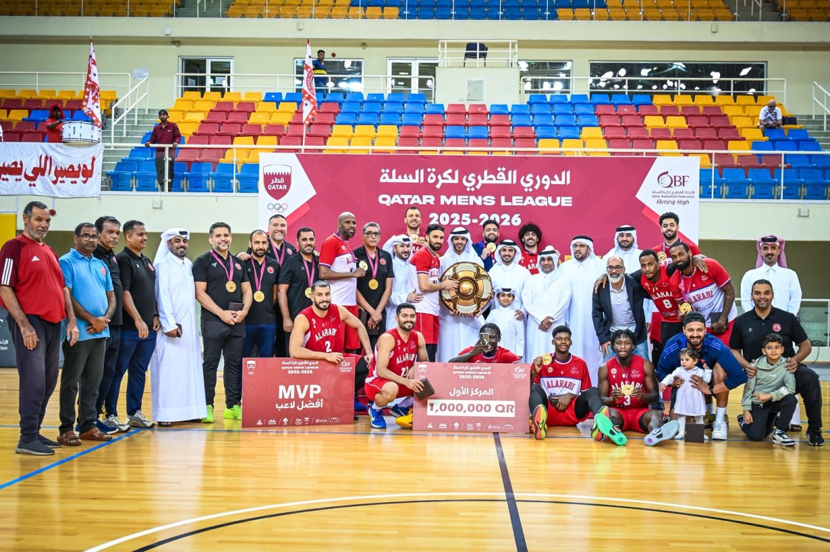 Qatar Basketball Federation President Mohammed bin Saad Al Mughaisib presents the trophy. 
