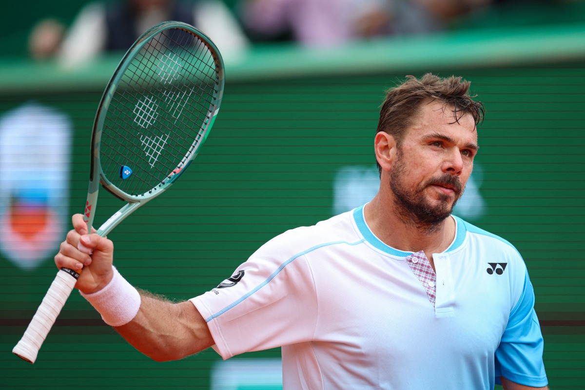 Switzerland's Stanislas Wawrinka reacts to a point against Argentinia's Sebastian Baez during the Monte Carlo ATP Masters Series Tournament round of 64 tennis match on Court Rainier III at the Monte-Carlo Country Club in Roquebrune-Cap-Martin, south-eastern France on April 6, 2026. (Photo by Valery HACHE / AFP)