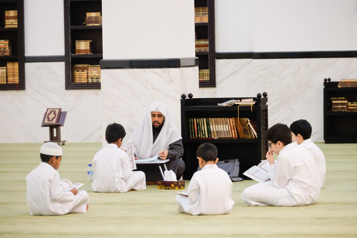 Children learn Quran recitation at a mosque.  
