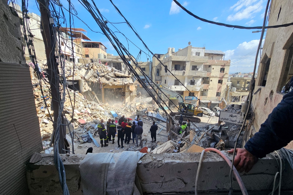 Workers clear rubble from the site of an Israeli airstrike the day before that targeted the Bir Hassan neighbourhood in Beirut's southern suburbs on April 9, 2026. (Photo by AFP)