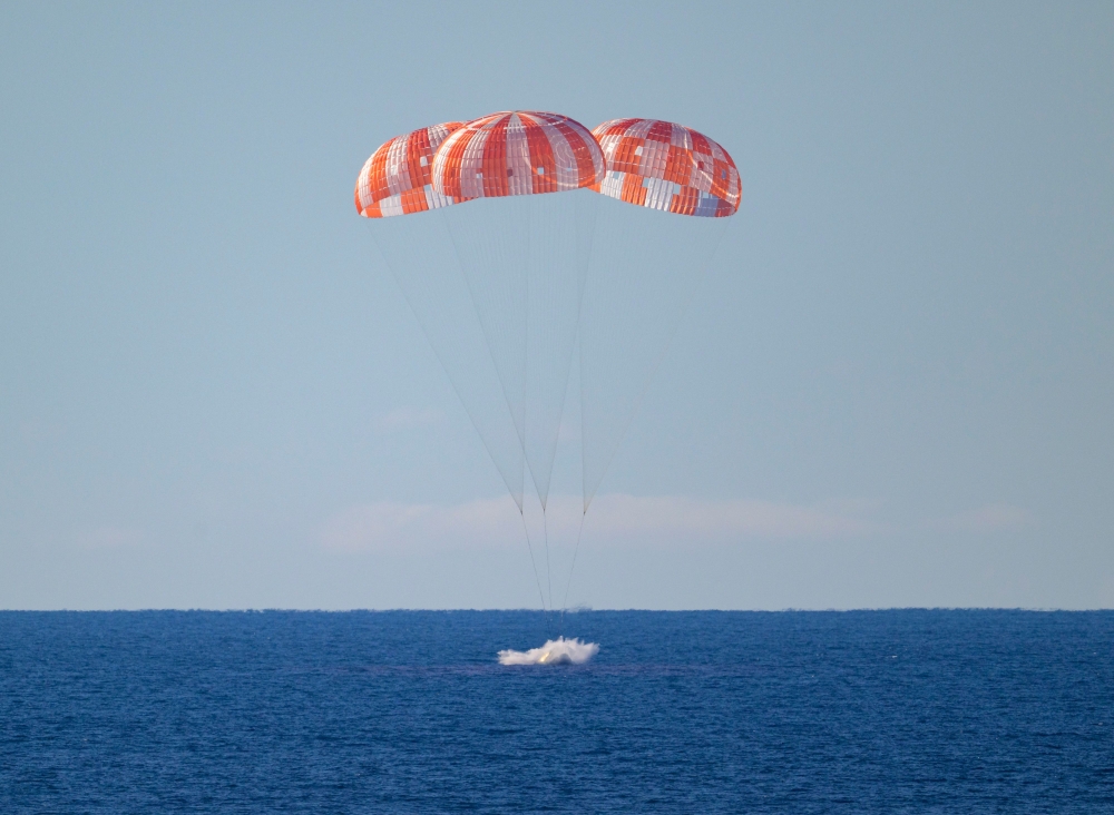 This handout photo released by NASA shows NASA's Orion spacecraft as it lands in the Pacific Ocean off the coast of California, on April 10, 2026. (Photo by Bill INGALLS / NASA / AFP) 