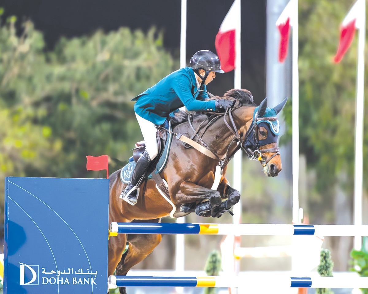 Saudi Arabian rider Abdullah Alsharbatly guides Frenchy Vds over a fence. 