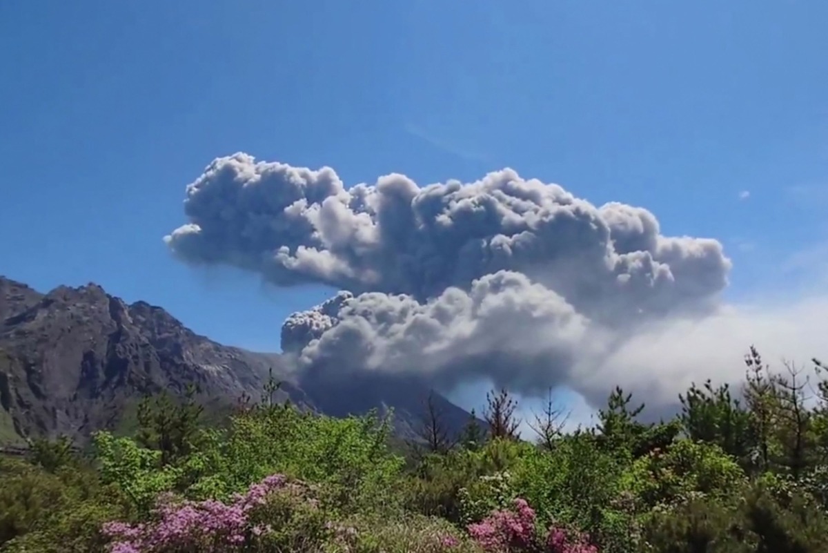 This screen grab made from UGC footage courtesy of X user @SEACHICKEN_1059 taken on April 11, 2026 and made available on April 13 shows Sakurajima, one of Japan's most active volcanoes, erupting in Japan's Kagoshima Prefecture. Photo by Handout / COURTESY OF @SEACHICKEN_1059 / AFP