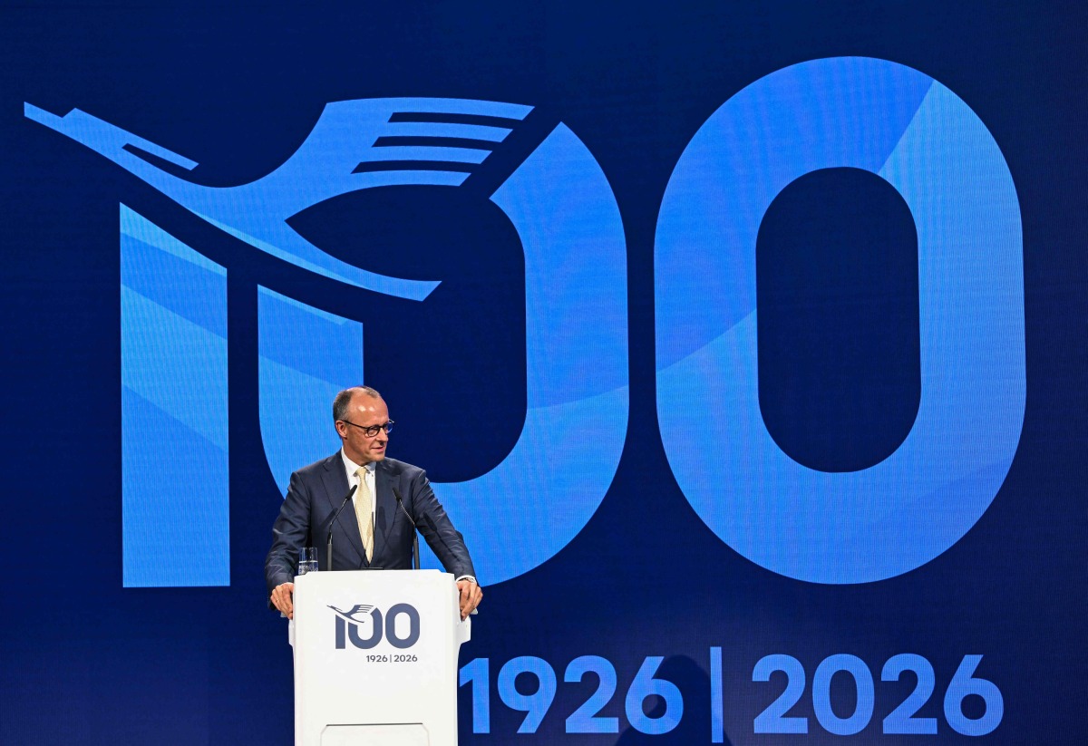 German Chancellor Friedrich Merz delivers a speech during a ceremony to celebrate the 100th anniversary of the founding of the first Lufthansa at Lufthansa Group Hangar One, Frankfurt Aiport, in Frankfurt am Main, western Germany on April 15, 2026. (Photo by Kirill KUDRYAVTSEV / AFP)