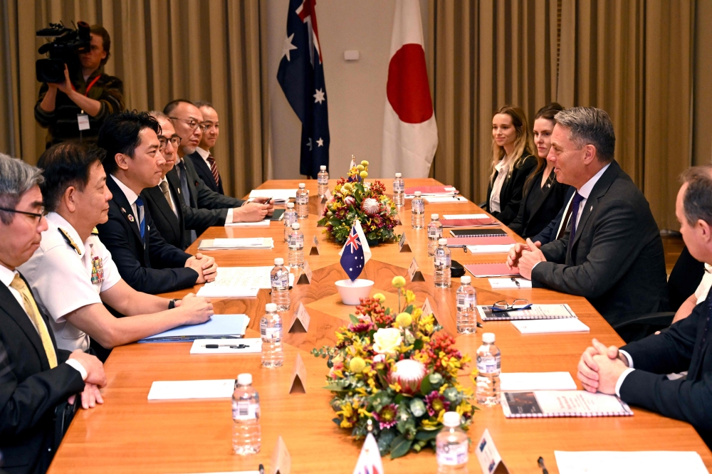 Australia's Deputy Prime Minister and Minister for Defence Richard Marles (2nd R) speaks with Japan's Minister of Defense Koizumi Shinjiro (3rd L) during a Defence Ministers' Meeting in Melbourne on April 18, 2026. (Photo by William West / AFP)
 
