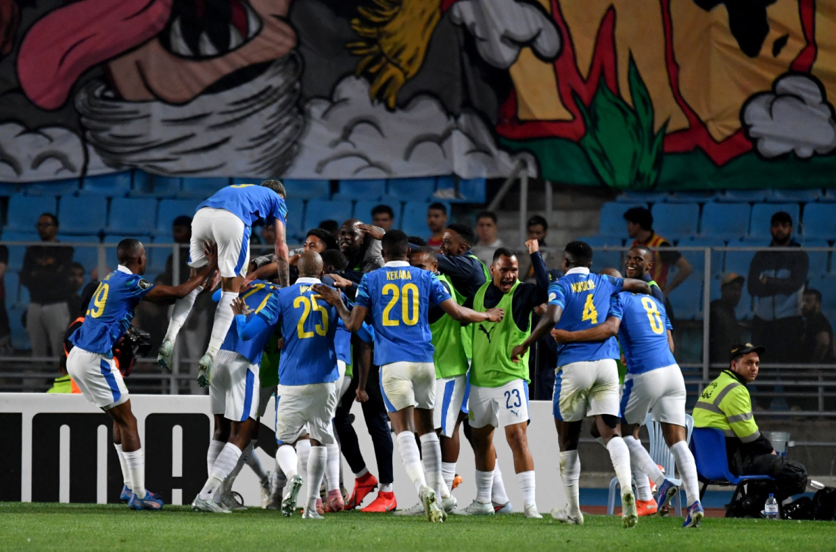 Sundowns' players celebrate after scoring their first goal during the CAF Champions League semi-final first leg football match between Esperance Sportive de Tunis (TUN) and Mamelodi Sundowns (RSA) at the Hammadi Agrebi Stadium in Rades on April 12, 2026. (Photo by FETHI BELAID / AFP)