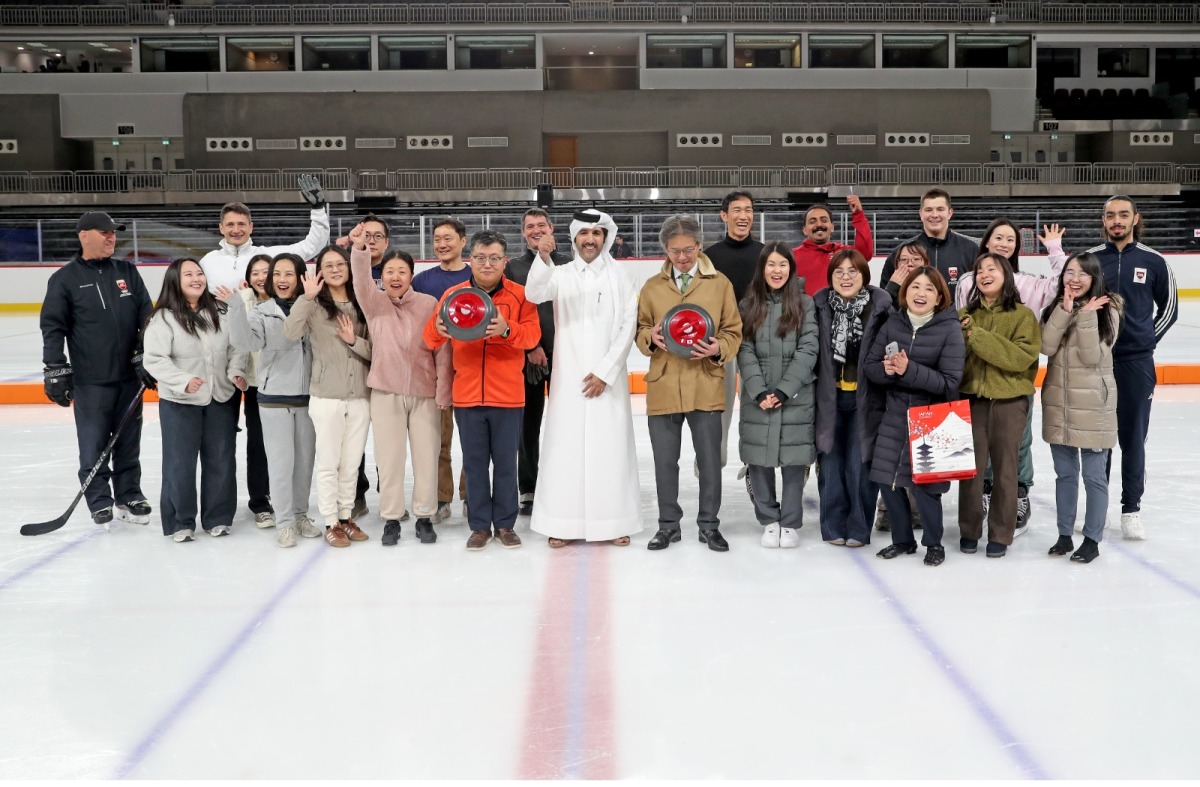 Ambassador of Korea H E Yun Hyunsoo and Ambassador of Japan H E Naoto Hisajima pose with embassy officials and staff at the Ali Bin Hamad Al Attiyah ice rink arena.