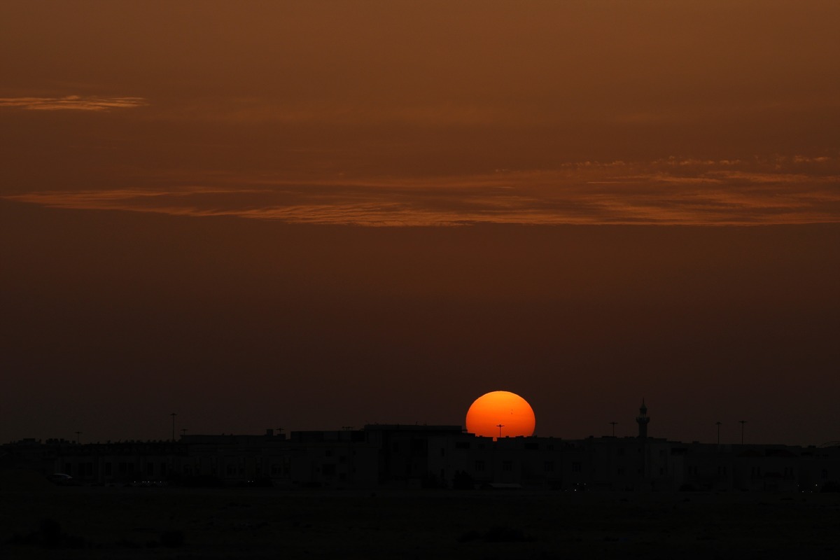 The sun sets over the city of Doha on April 17, 2026. (Photo by AFP)