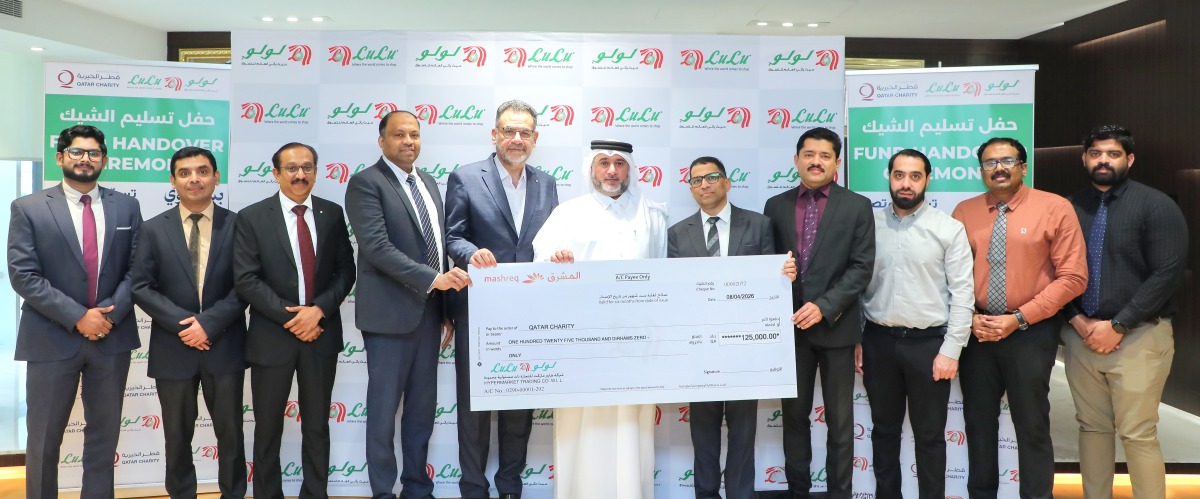 Regional Director of LuLu Hypermarket Qatar, Shanavas P M, presenting a cheque to Deputy Director of Donor Relations at Qatar Charity, Amer Mohammed AlBesiri.