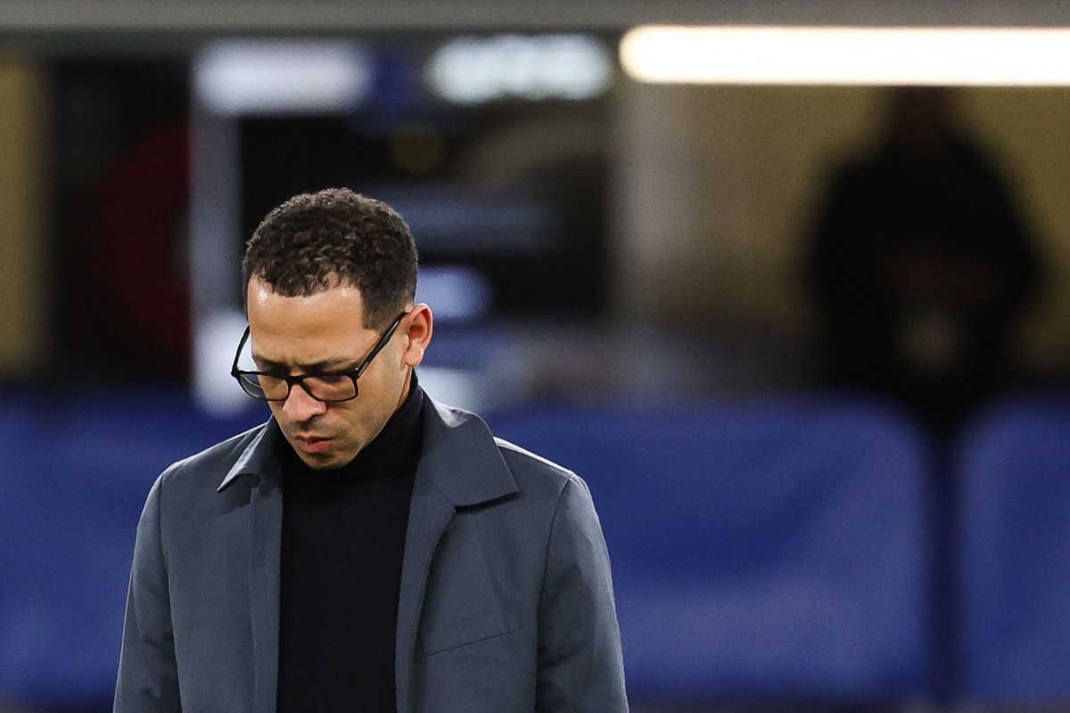 (FILES) Chelsea's English head coach Liam Rosenior looks down ahead of the UEFA Champions League round of 16 second leg football match between Chelsea FC and Paris Saint-Germain (PSG) at Stamford Bridge, west London on March 17, 2026. (Photo by FRANCK FIFE / AFP)