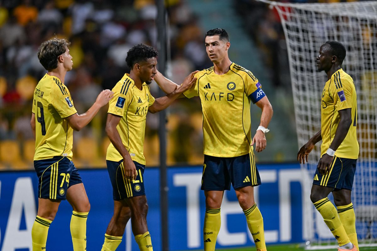 Al Nassr’s Kingsley Coman (centre) celebrates with Cristiano Ronaldo (right) during the semi-final.  