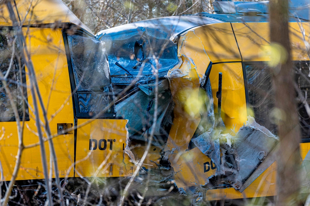 This photograph shows two trains that collided between the towns of Hillerod and Kagerup, north of Copenhagen, leaving many injured, on April 23, 2026. (Photo by Steven Knap / Ritzau Scanpix / AFP) 
