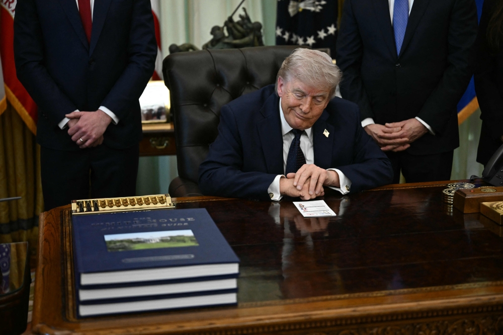 US President Donald Trump gestures during a meeting at the White House in Washington, DC on April 23, 2026. (Photo by Brendan Smialowski / AFP)