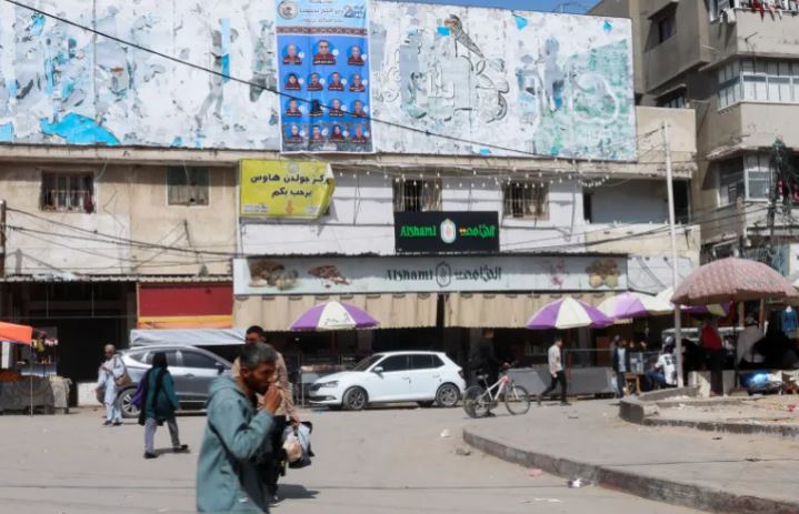 A poster of electoral candidates in Deir el-Balah in Gaza. Photo by Haseeb Alwazeer/Reuters