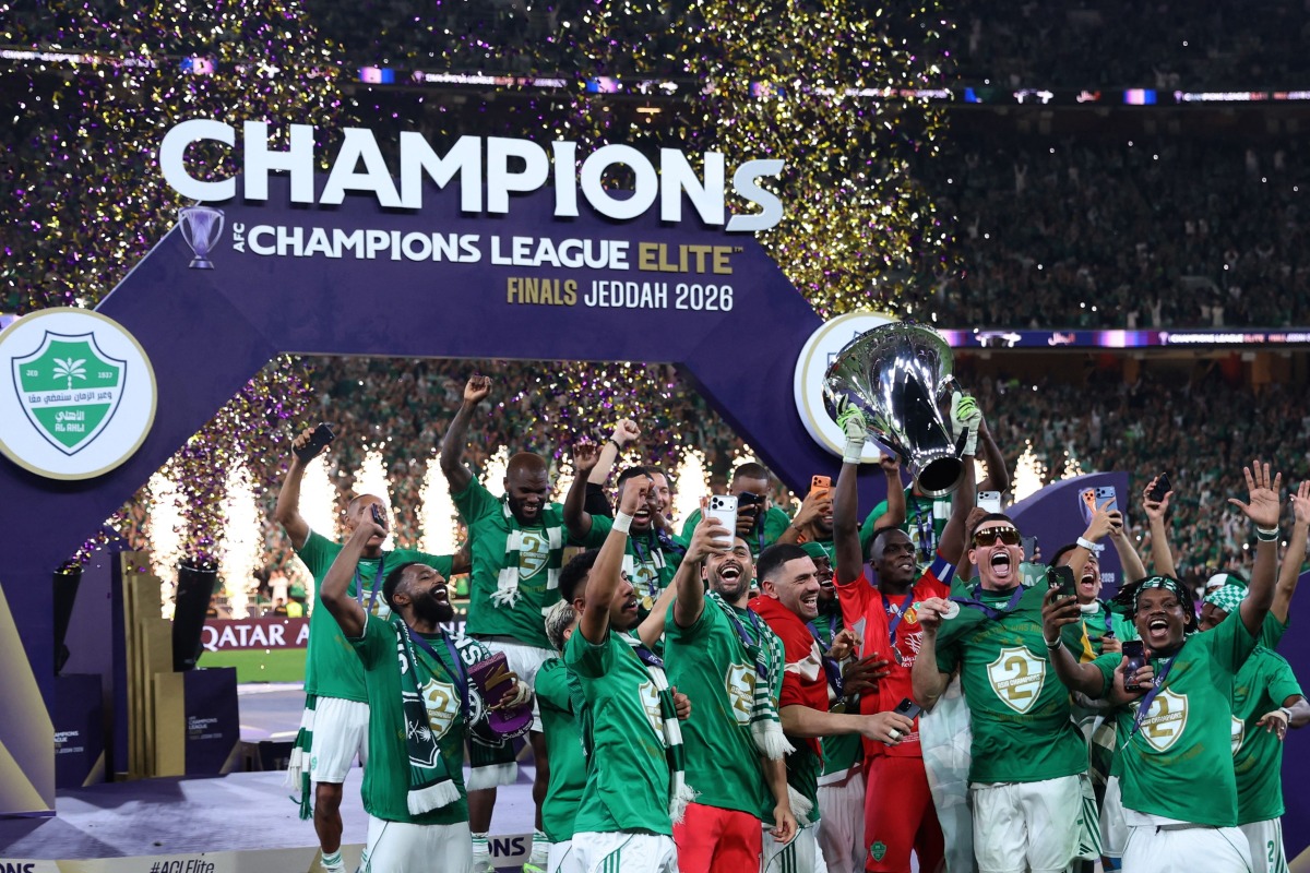 Al-Ahli players celebrate with the trophy after beating Machida Zelvia 1-0 in the final of the AFC Champions League football match between Al-Ahli Saudi FC and FC Machida Zelvia at the King Abdullah Sports City, in Jeddah on April 25, 2026. (Photo by Abdel Ghani BASHIR / AFP)