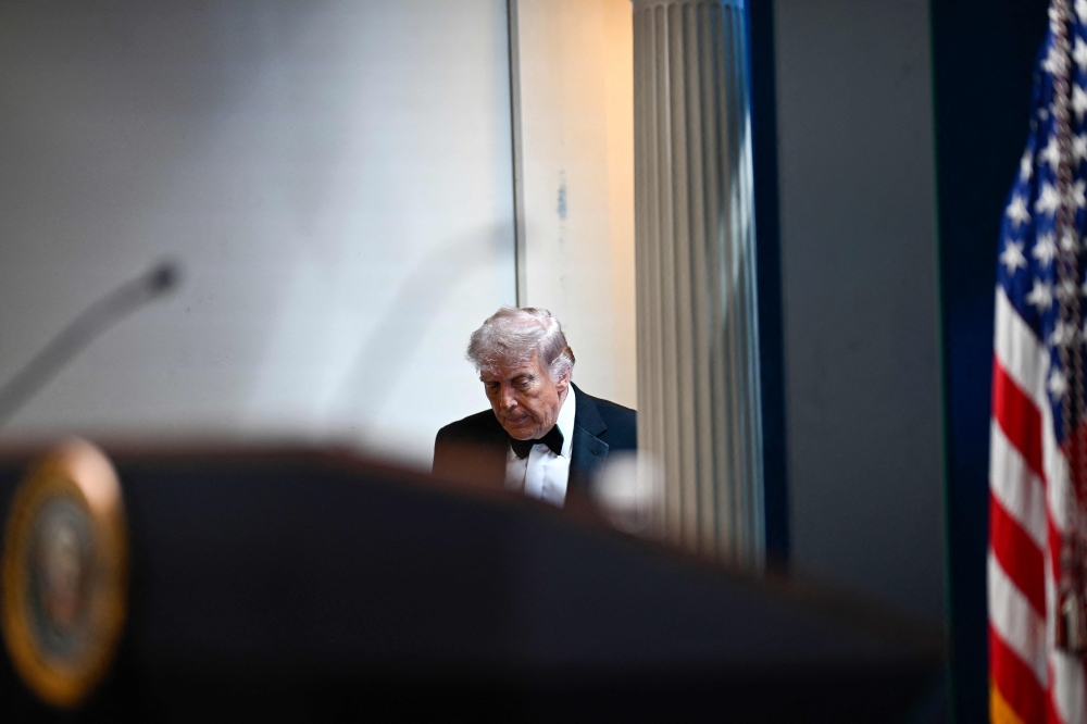 US President Donald Trump arrives to speak during a press briefing in the Brady Briefing Room at the White House in Washington, DC, shortly after a shooting incident at the White House Correspondents’ Dinner. (Photo by Kent Nishimura / AFP)
 